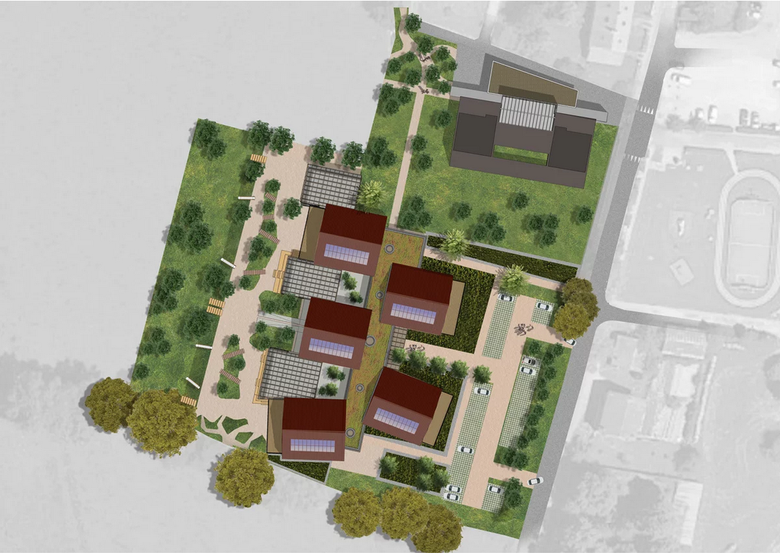 Plan architectural vu du dessus d'un complexe scolaire moderne et écologique, composé de plusieurs bâtiments aux toits rouges équipés de panneaux solaires. L'école est entourée d'espaces verts, d'aires de jeux et de zones piétonnes aménagées. Un parking est situé à l'avant avec des allées arborées menant aux entrées principales. La conception met en avant une intégration harmonieuse avec la nature et une approche durable grâce aux toitures végétalisées et aux énergies renouvelables.
